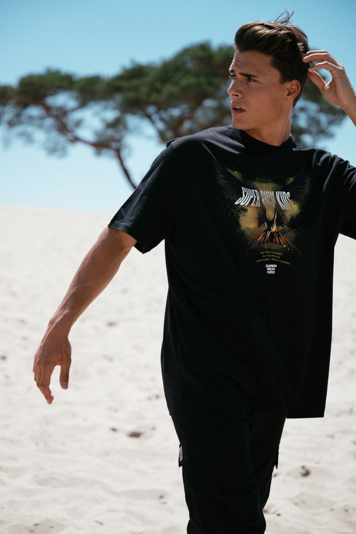 T-Shirt 'Highest in the Room' Zwart met Geel