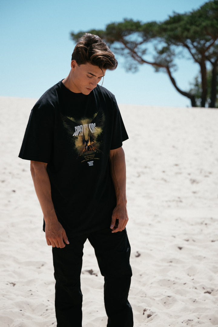 T-Shirt 'Highest in the Room' Zwart met Geel