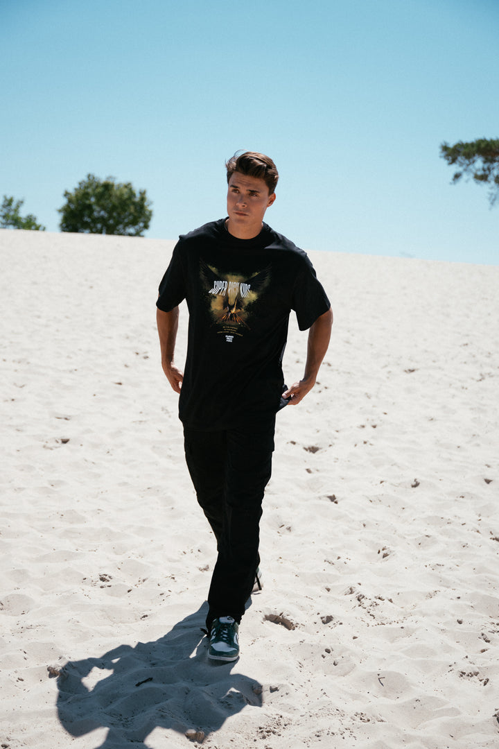 T-Shirt 'Highest in the Room' Zwart met Geel